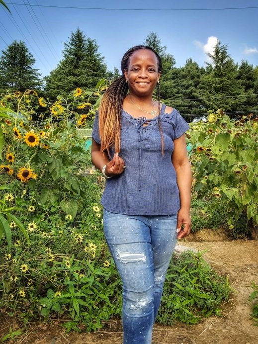 Me at Banyawol Lotus Complex with sunflowers in the background